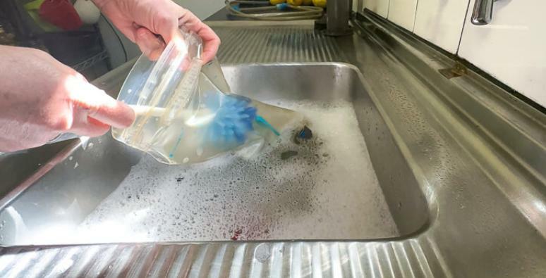 Cleaning hydration bladder with soapy water