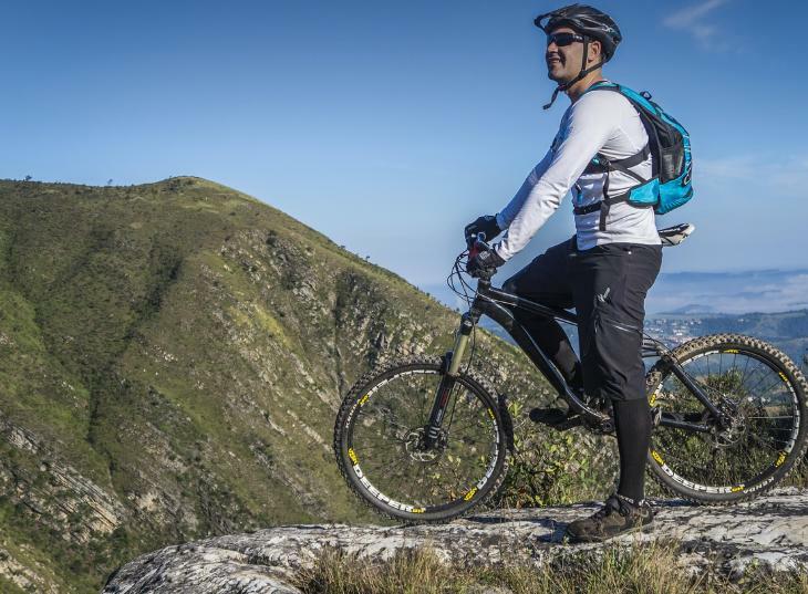 Cyclist enjoying a trail ride with a hydration pack